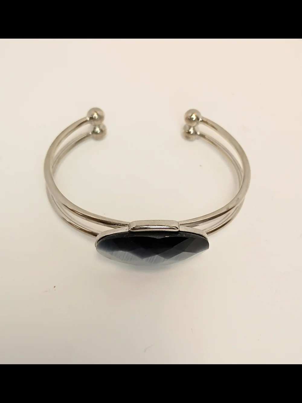 Silver-Tone Bracelet with Faceted Black Oval Center